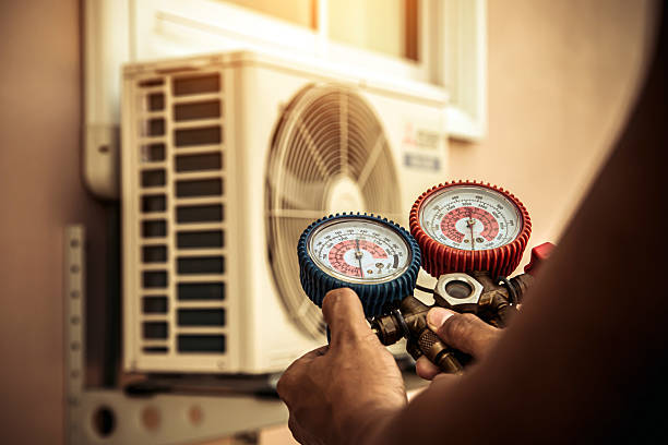 Professional Air Conditioning Service technician working in Wilsonville, AL